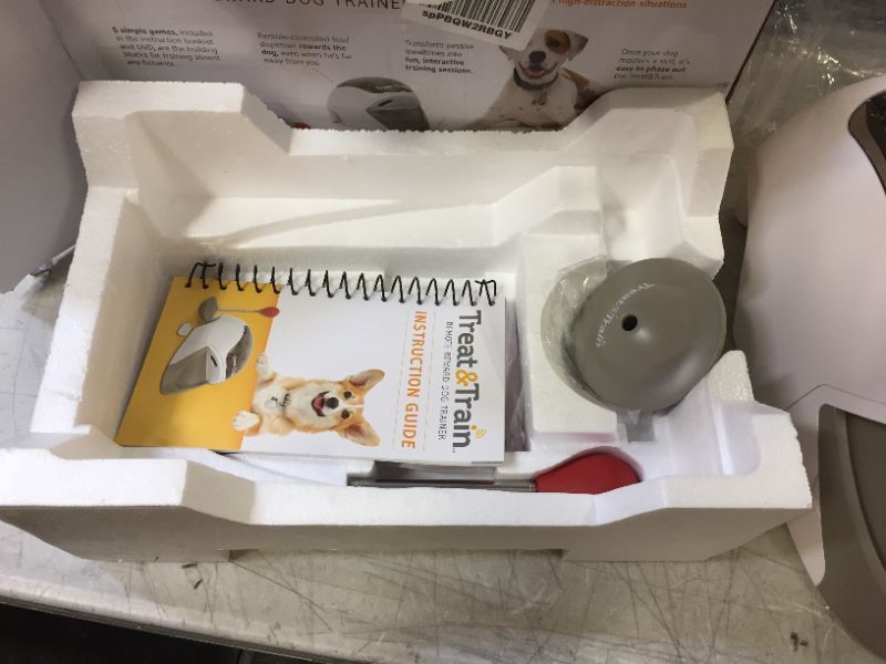 Photo 3 of PetSafe Treat & Train - Remote Treat Dispensing Dog Training System, Positive Reinforcement, Calm Behavior, Distraction Avoidance, Includes Training DVD, Target Wand & Remote, For Dogs 6 Months & Up
