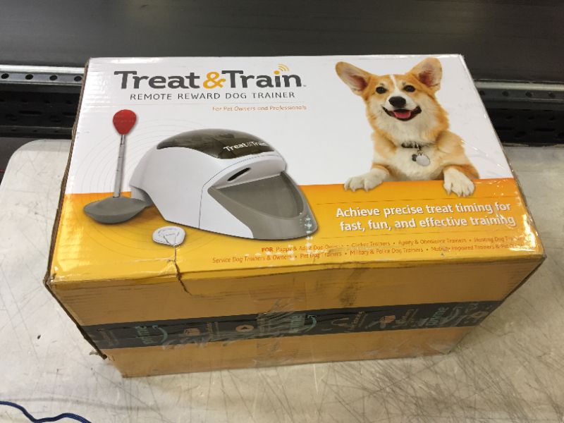 Photo 4 of PetSafe Treat & Train - Remote Treat Dispensing Dog Training System, Positive Reinforcement, Calm Behavior, Distraction Avoidance, Includes Training DVD, Target Wand & Remote, For Dogs 6 Months & Up
