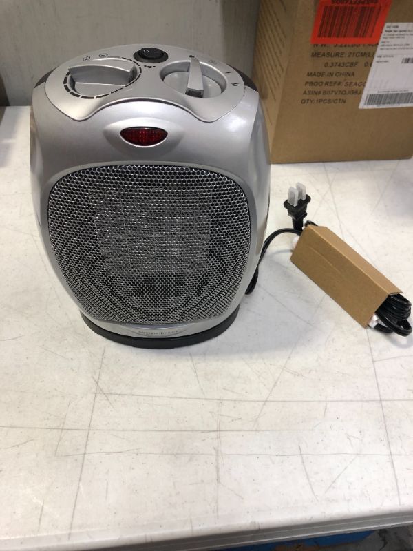 Photo 1 of Amazon Basics 1500W Oscillating Ceramic Heater with Adjustable Thermostat, Silver
