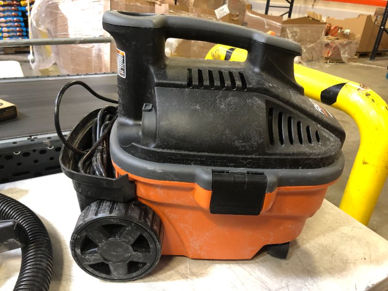Photo 1 of Ridgid WD4070 4 Gallon Portable Vacuum
(( OPEN BOX ))
** HEAVY USE **