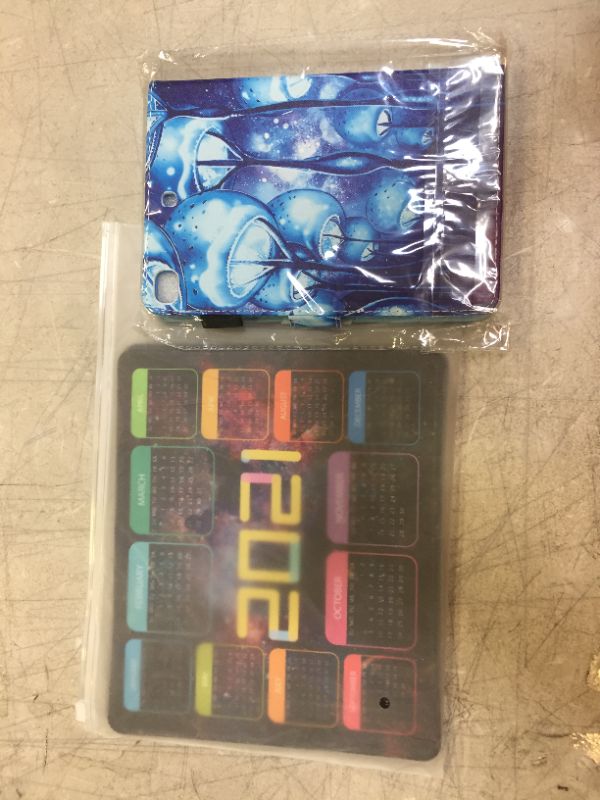 Photo 1 of 2 mouse pads and a tablet case