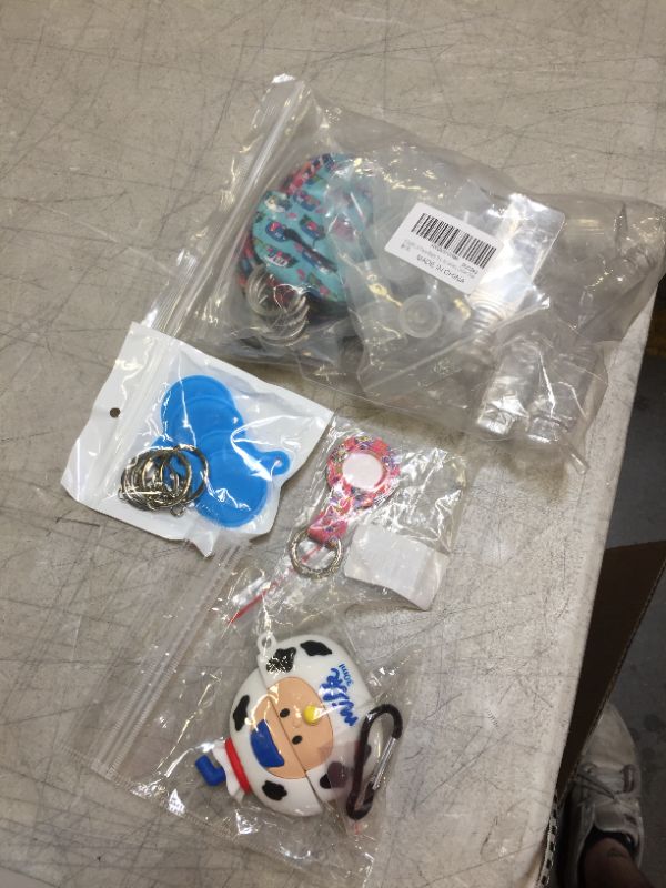 Photo 1 of 4 pack of key chains and air pod case