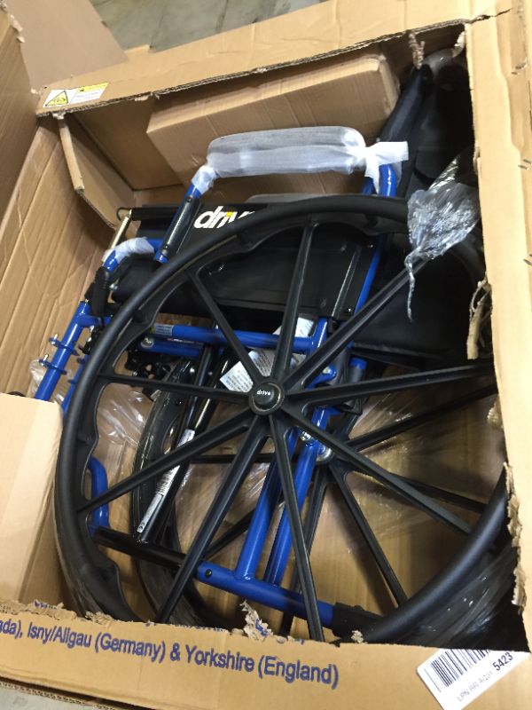 Photo 3 of Drive Medical Blue Streak Wheelchair with Flip Back Desk Arms, Elevating Leg Rests, 18 inch Seat
box is damaged