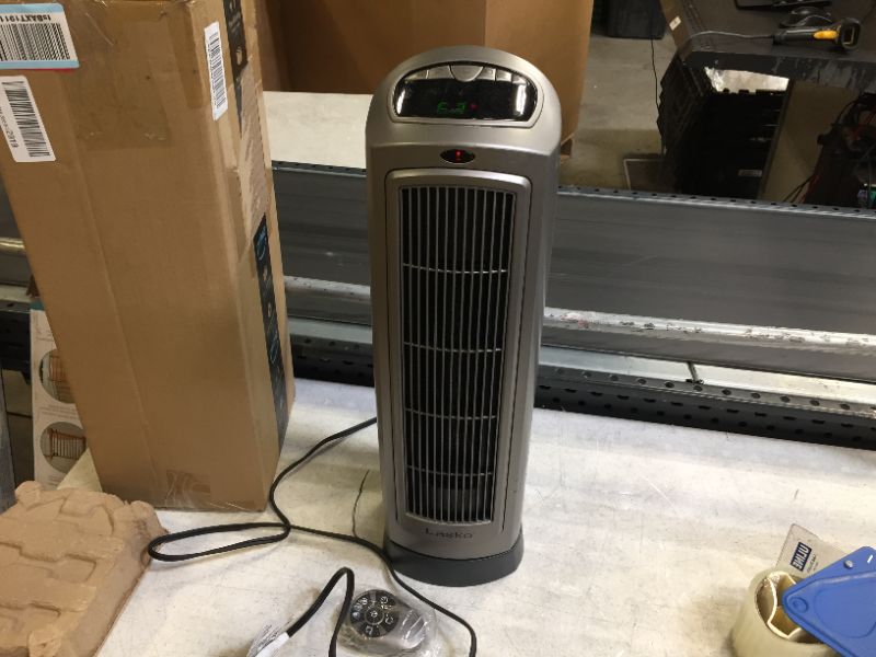 Photo 2 of Lasko 755320 Ceramic Space Tower Heater, 8.5?L x 7.25?W x 23?H, Silver
