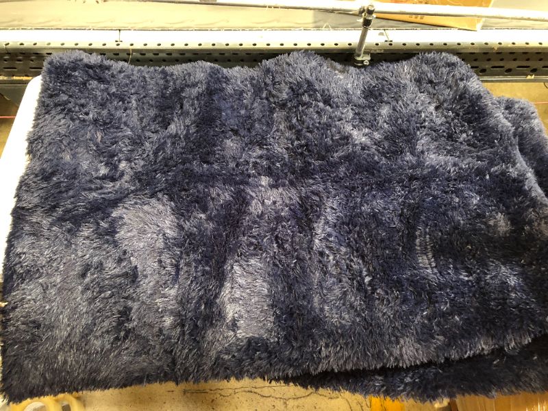 Photo 1 of 62"X 8' fuzzy navy mat 