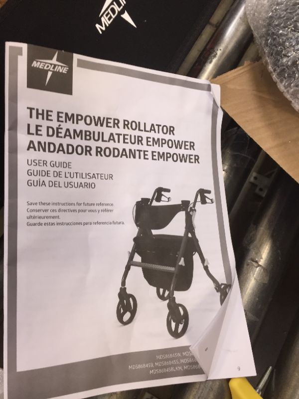 Photo 7 of Medline Empower Rollator, Smoky Black --- missing one of the yellow triangle things(fasteners?)