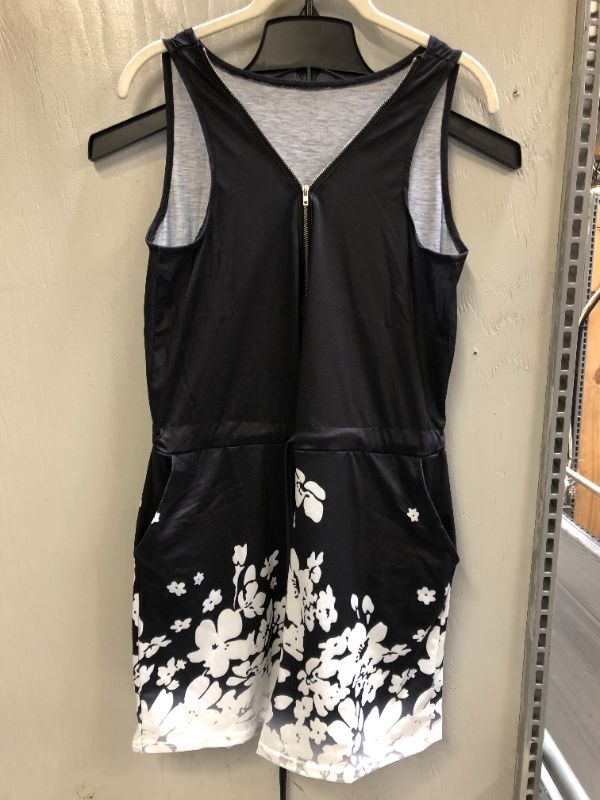 Photo 1 of women's romper 
size unknow (looks like a S/M)