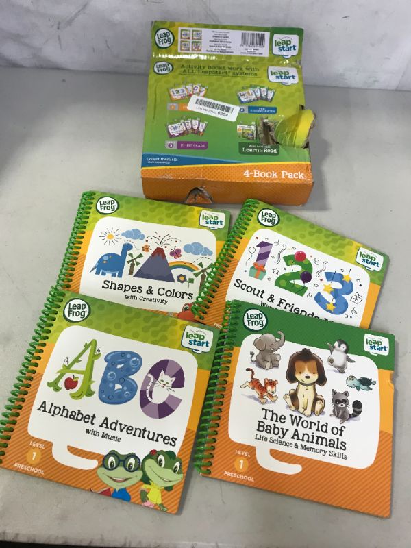 Photo 2 of LeapFrog LeapStart Preschool 4-in-1 Activity Book Bundle with ABC, Shapes & Colors, Math, Animals
(MAJOR DAMAGES TO BOX FROM EXCOSURE)