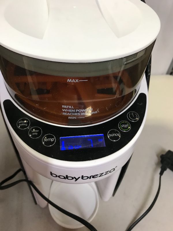 Photo 2 of New and Improved Baby Brezza Formula Pro Advanced Formula Dispenser Machine - Automatically Mix a Warm Formula Bottle Instantly - Easily Make Bottle with Automatic Powder Blending (WARE ON ITEM INDICATE MODERATE USE, MILK AND STAINS ON ITEM, MISSING PEICE