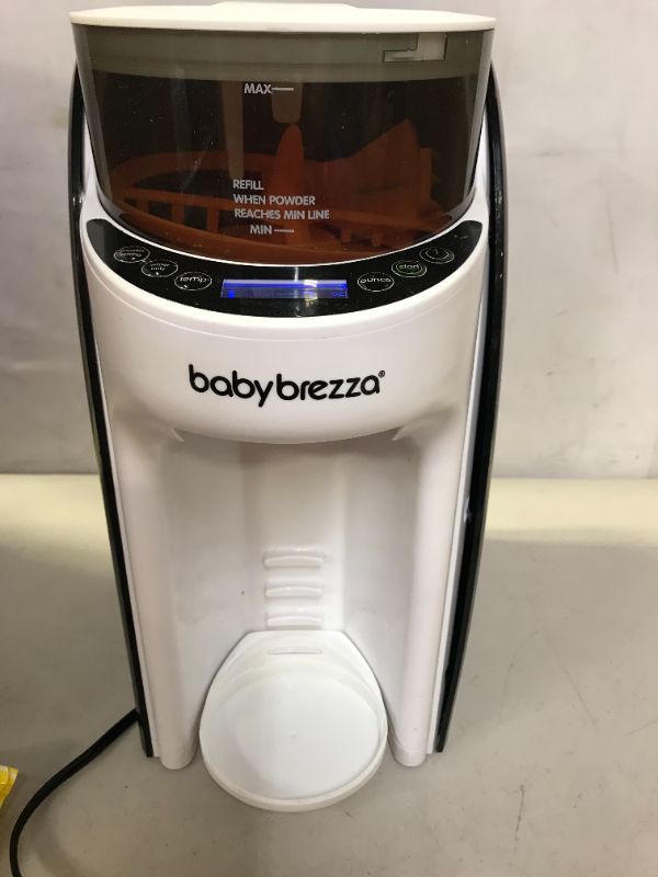 Photo 1 of New and Improved Baby Brezza Formula Pro Advanced Formula Dispenser Machine - Automatically Mix a Warm Formula Bottle Instantly - Easily Make Bottle with Automatic Powder Blending (WARE ON ITEM INDICATE MODERATE USE, MILK AND STAINS ON ITEM, MISSING PEICE