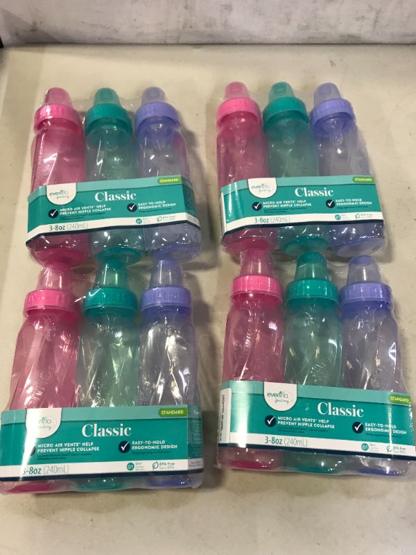 Photo 1 of Evenflo Feeding Classic Tinted Plastic Standard Neck Bottles for Baby, Infant and Newborn, Pink/Lavender/Teal, 8 Ounce (Pack of 12)
