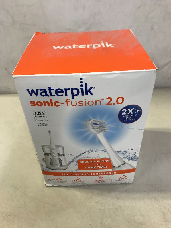 Photo 2 of Waterpik Sonic-Fusion 2.0 Flossing Electric Toothbrush, White MINOR DAMAGES TO PACKAGING 
