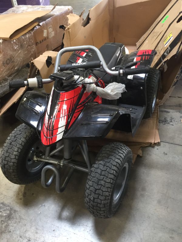 Photo 2 of Razor Dirt Quad - 24V Electric 4-Wheeler ATV - Twist-Grip Variable-Speed Acceleration Control, Hand-Operated Disc Brake, 12" Knobby Air-Filled Tires