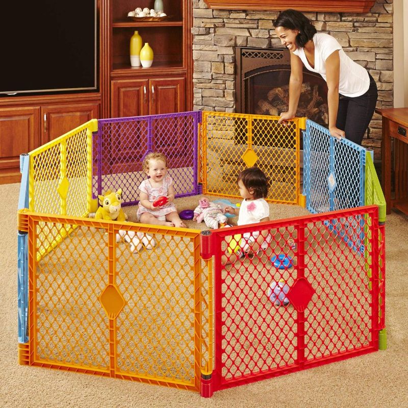 Photo 1 of Toddleroo by North States Superyard Colorplay 8 Panel Baby Play Yard: Safe play area anywhere. Folds up with carrying strap for easy travel. Freestanding. 34.4 sq. ft. enclosure (26" Tall, Multicolor)
