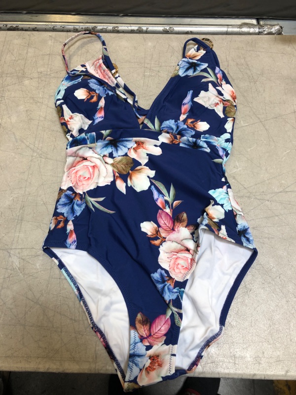 Photo 2 of Blue Floral Strappy One Piece Swimsuit. Small
Blue And White Stripe Halter One Piece Swimsuit. Small

