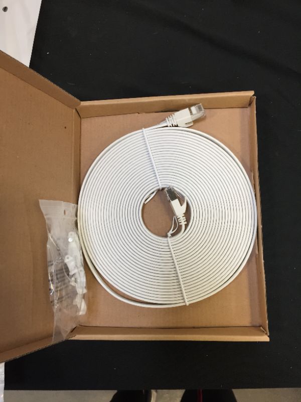 Photo 1 of Amazon Basics Cat 7 Gigabit Ethernet Patch Internet Cable, Flat - 25FT, 1Pack, White - Include 10 Nails