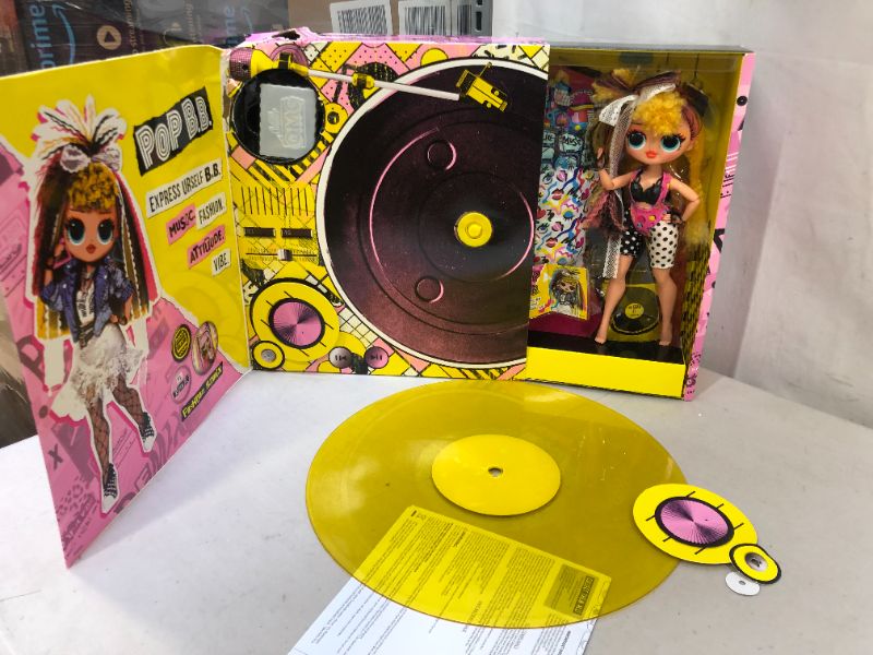 Photo 1 of LOL Surprise OMG Remix Pop B.B. Fashion Doll, Plays Music, with Extra Outfit and 25 Surprises Including Shoes, Hair Brush, Doll Stand, Magazine, and Record Player Package - for Girls Ages 4+
