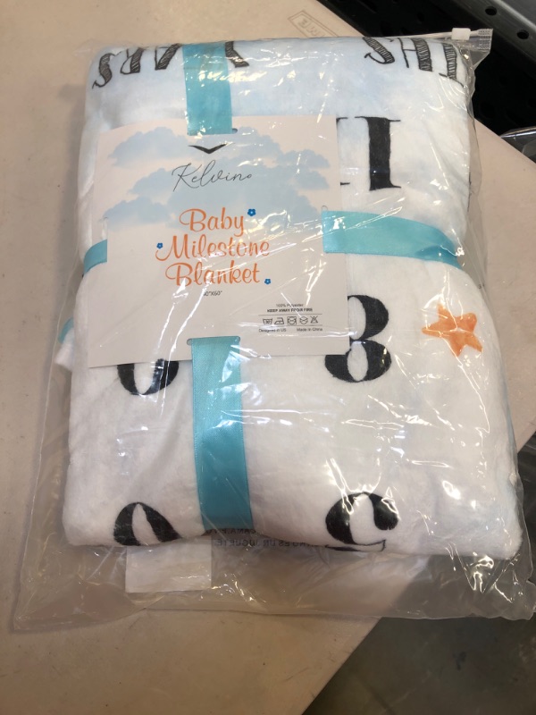 Photo 2 of KELVINO Baby Milestone Blanket – Soft & Fluffy Premium Flannel Fleece Baby Growth Chart Blanket with Sun & Cloud Shaped Felt Photography Props & Bib, Light Blue & White 60 x 40 inches
