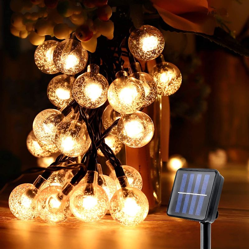 Photo 1 of Globe Outdoor Solar String Lights, 23Ft 50LED Waterproof Solar Powered Outdoor Lights, 8 Modes Crystal Balls Decorative Fairy Lighting for Christmas Lights ,Tree, Patio, Balcony,Garden, Yard--Yellow
