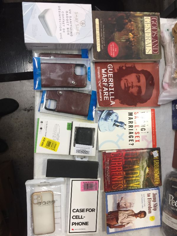 Photo 1 of Bundle of items, books and phone accesories