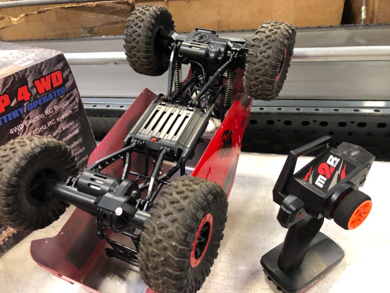 Photo 1 of GoolRC WLtoys 104311 RC Car, 1/10 Scale 4WD 2.4Ghz Remote Control Car, Brushed Motor Off-Road Crawler Car RTR for Kids and Adults