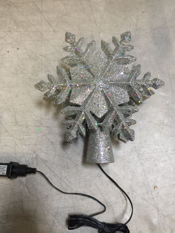 Photo 1 of Christmas Tree Topper Lighted with Built-in Led Rotating Snowflake Projector Lights, 9.6”