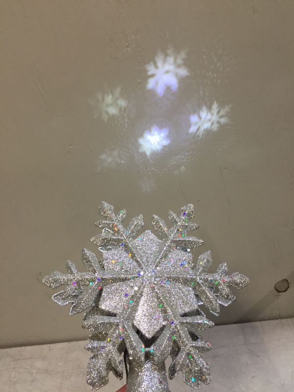 Photo 2 of Christmas Tree Topper Lighted with Built-in Led Rotating Snowflake Projector Lights, 9.6”