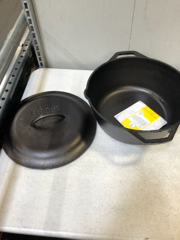 Photo 1 of Lodge Seasoned Cast Iron Dutch Oven, 5-Qt.---ITEM IS DIRTY---
