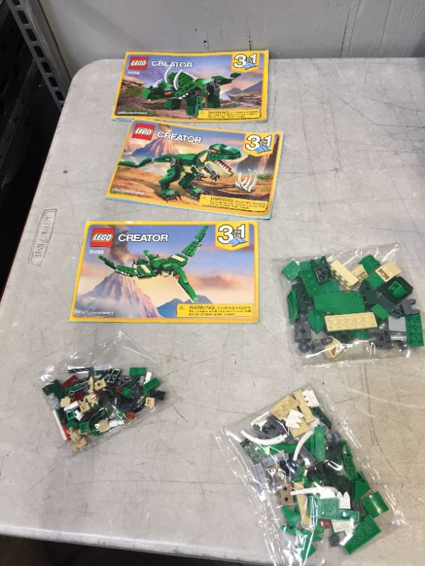 Photo 1 of LEGO Creator Mighty Dinosaurs Build It Yourself Dinosaur Set, Pterodactyl, Triceratops, T Rex Toy 31058

