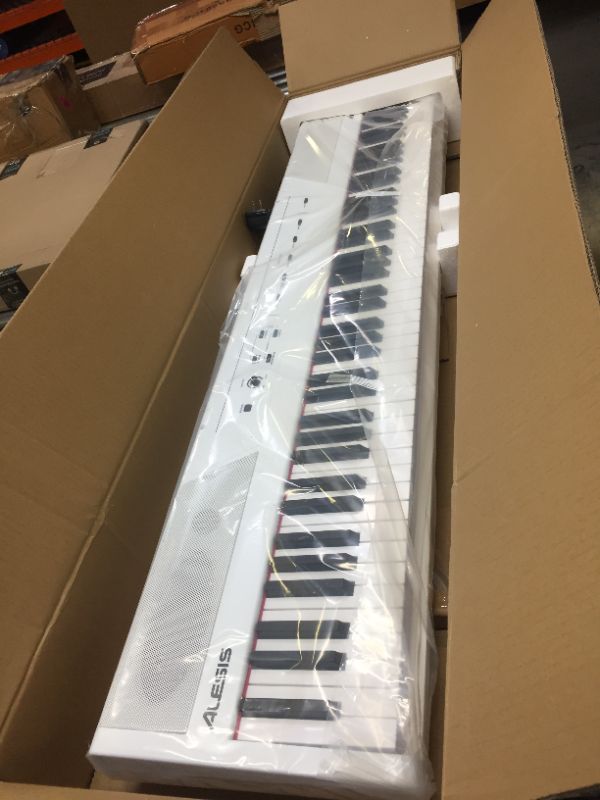 Photo 2 of Alesis Recital White | All White 88-Key Digital Piano / Keyboard with Full-Size Semi-Weighted Keys, Power Supply, Built-in Speakers and 5 Premium