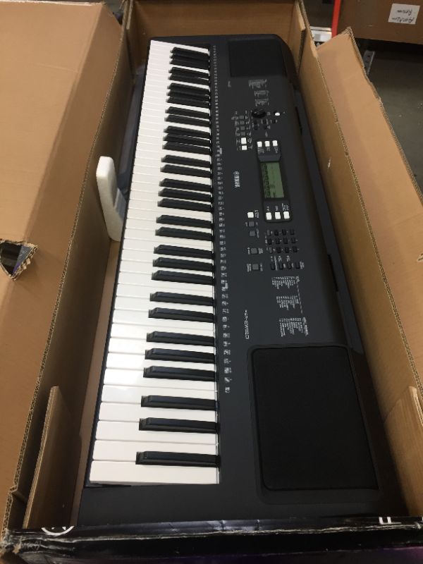 Photo 2 of YAMAHA PSREW310 76 KEY PORTABLE KEYBOARD