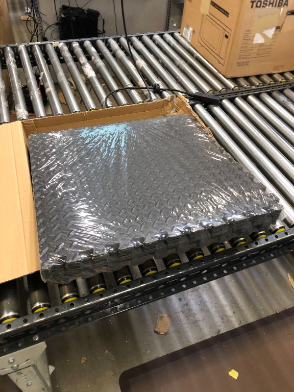 Photo 2 of  AmazonBasics EVA Foam Interlocking Exercise Gym Floor Mat Tiles - Pack of 6, 24 x 24 x .5 Inches, Black
