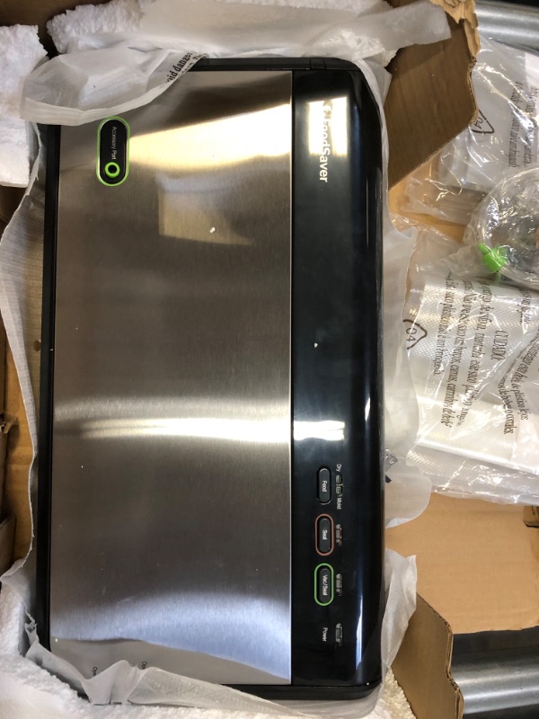 Photo 1 of FoodSaver Vacuum Sealing System with Bonus Handheld Sealer and Starter Kit, Silver
