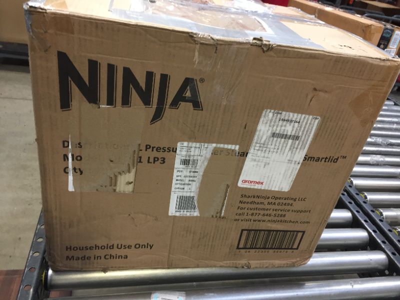 Photo 1 of Ninja OL601 Foodi XL 8 Qt. Pressure Cooker Steam Fryer with SmartLid, 14-in-1 that Air Fries, Bakes & More, with 3-Layer Capacity, 5 Qt. Crisp Basket Silver/Black