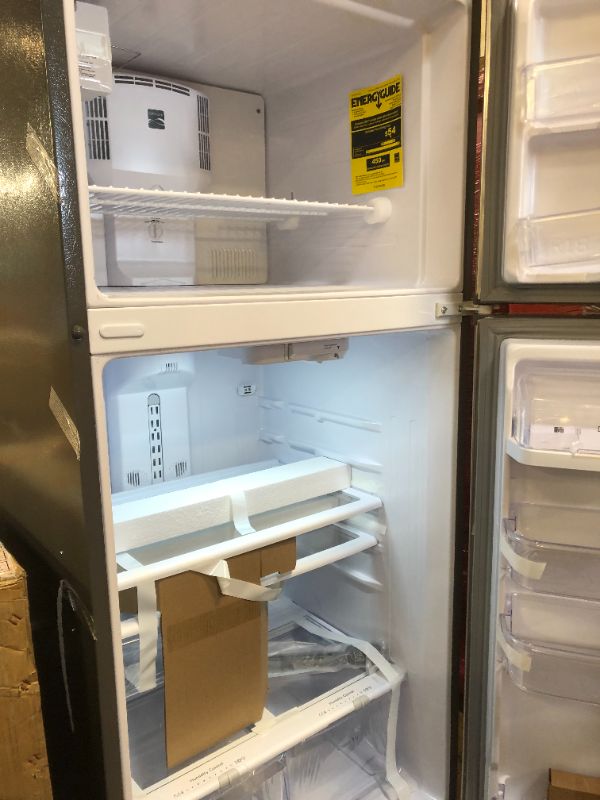Photo 4 of Kenmore 70715 18 cu. ft. ENERGY STAR Top Freezer Refrigerator with Ice Maker Pre-Installed - Finger Print Resistant Stainless Steel
