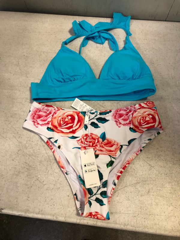 Photo 1 of womens bathing suit blue top floral bottom
size medium