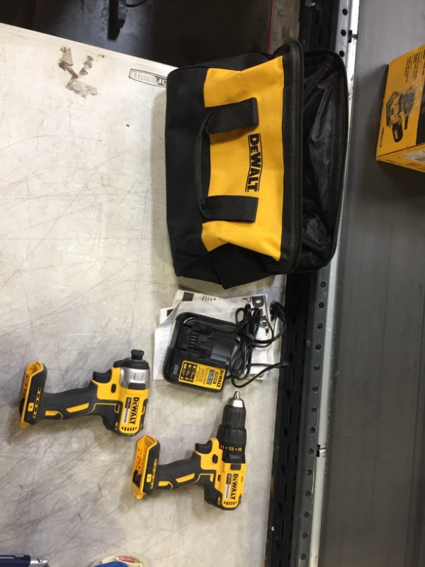 Photo 1 of 2 dewalt drills a battery charger and bag 