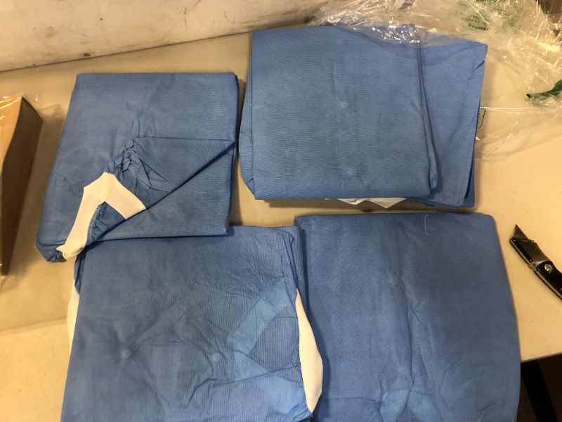 Photo 2 of EZGOODZ Disposable Lab Jackets,33in.Pack of 10 Blue Hip-Length Work Gowns Xxl.SMS 50 gsm Shirts with Snaps Front,Knit Cuffs and Collar,3 Pockets.Unisex PPE Body Protective Short Coats,10JMB2XL
