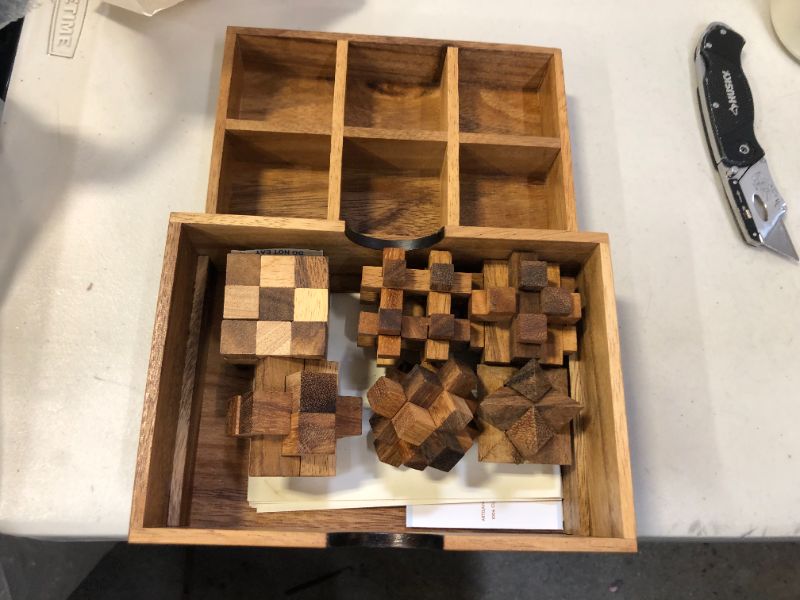 Photo 2 of NOVICA Handmade Rain Tree Wood Puzzle Set, Brown Color
