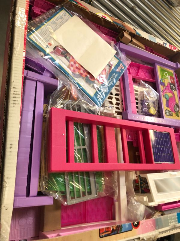 Photo 4 of Barbie Dreamhouse Dollhouse with Wheelchair Accessible Elevator, Pool, Slide and 70 Accessories Including Furniture and Household Items, Gift for 3 to 7 Year Olds
