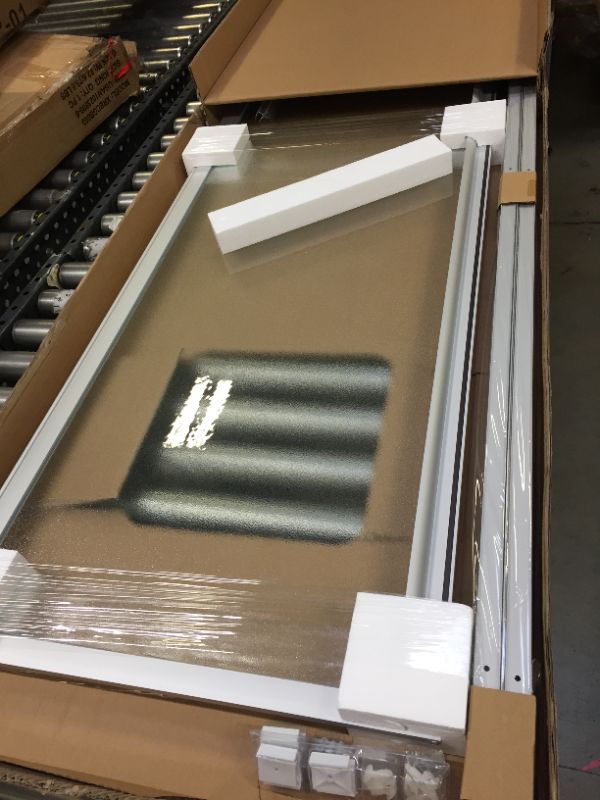 Photo 1 of 24 in. x 64 in. Framed Pivot Shower Door Kit in Silver with Pebbled Glass
