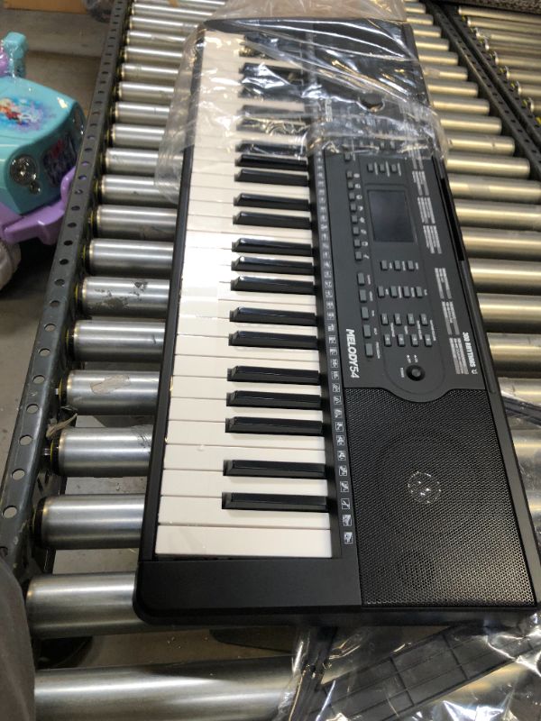 Photo 7 of Alesis Melody 54 - Electric Keyboard Digital Piano with 54 Keys, Speakers, 300 Sounds, 300 Rhythms, 40 Songs, Microphone and Piano Lessons
