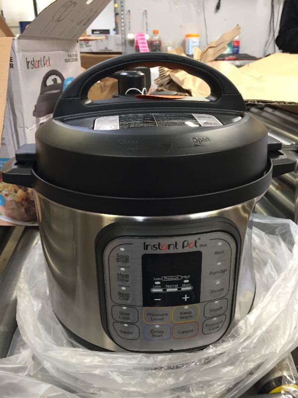 Photo 2 of Instant Pot Duo 7-in-1 Electric Pressure Cooker, Slow Cooker, Rice Cooker, Steamer, Sauté, Yogurt Maker, Warmer & Sterilizer, 3 Quart, Stainless Steel/Black
(( DENT ON THE SIDE ))