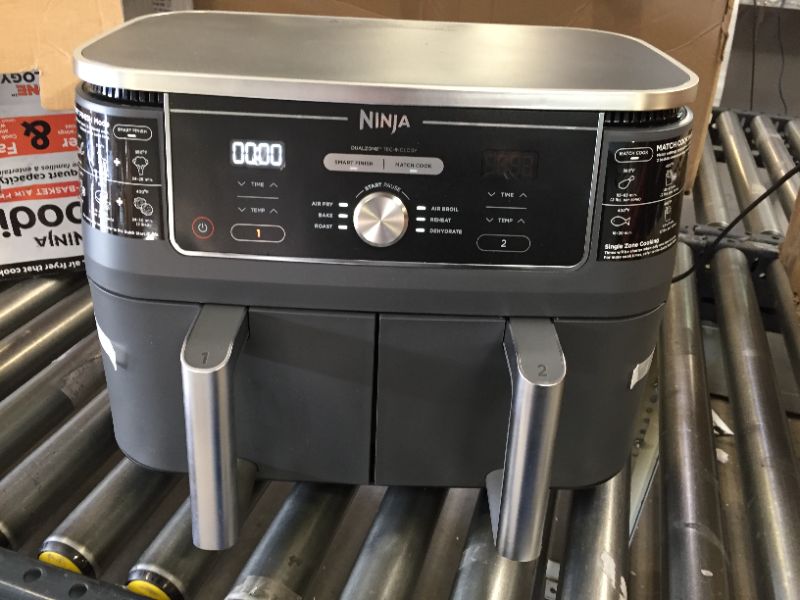 Photo 2 of Ninja DZ401 Foodi 10 Quart 6-in-1 DualZone XL 2-Basket Air Fryer with 2 Independent Frying Baskets, Match Cook & Smart Finish to Roast, Broil, Dehydrate & More for Quick, Easy Family-Sized Meals, GreyG
(( OPEN BOX ))