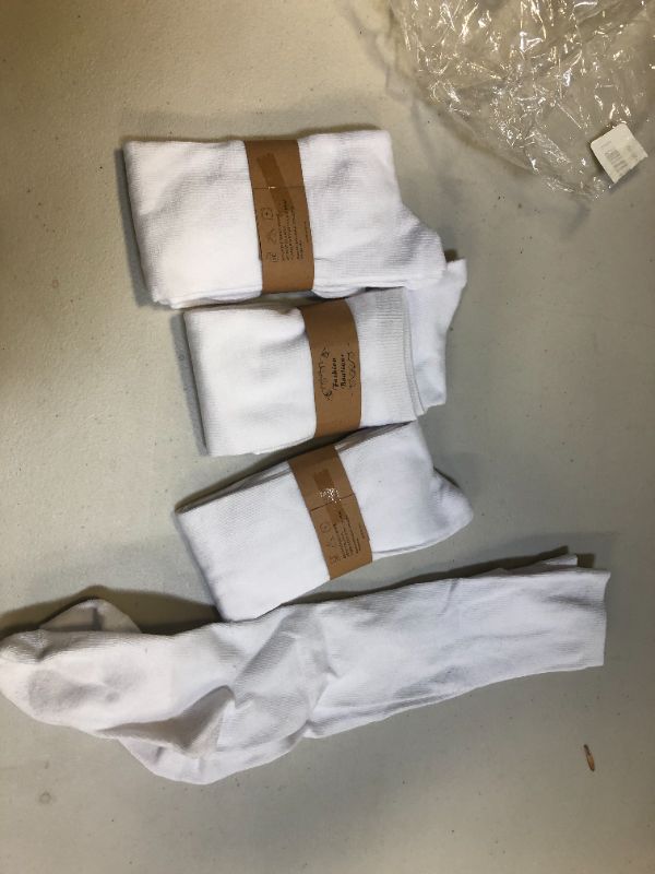 Photo 1 of 4 pairs of socks