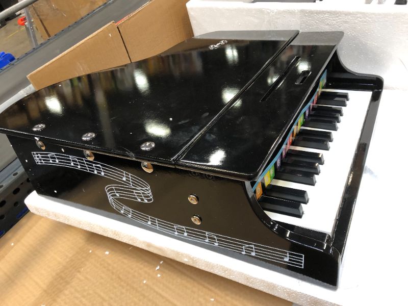 Photo 1 of Melissa & Doug Learn-to-play Classic Grand Piano, Mini Keyboard with 30 Hand-tuned Keys (23.65? H X 21.4? W X 10.05? L, E-commerce Packaging)
