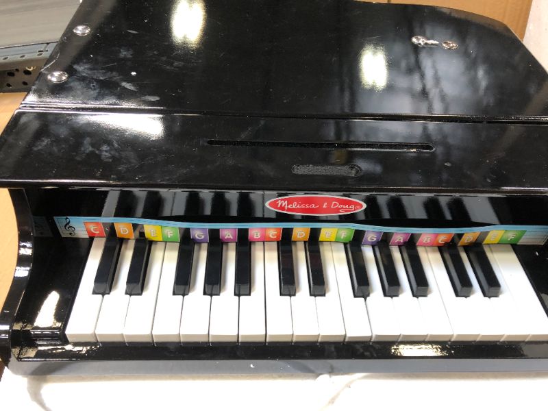 Photo 2 of Melissa & Doug Learn-to-play Classic Grand Piano, Mini Keyboard with 30 Hand-tuned Keys (23.65? H X 21.4? W X 10.05? L, E-commerce Packaging)
