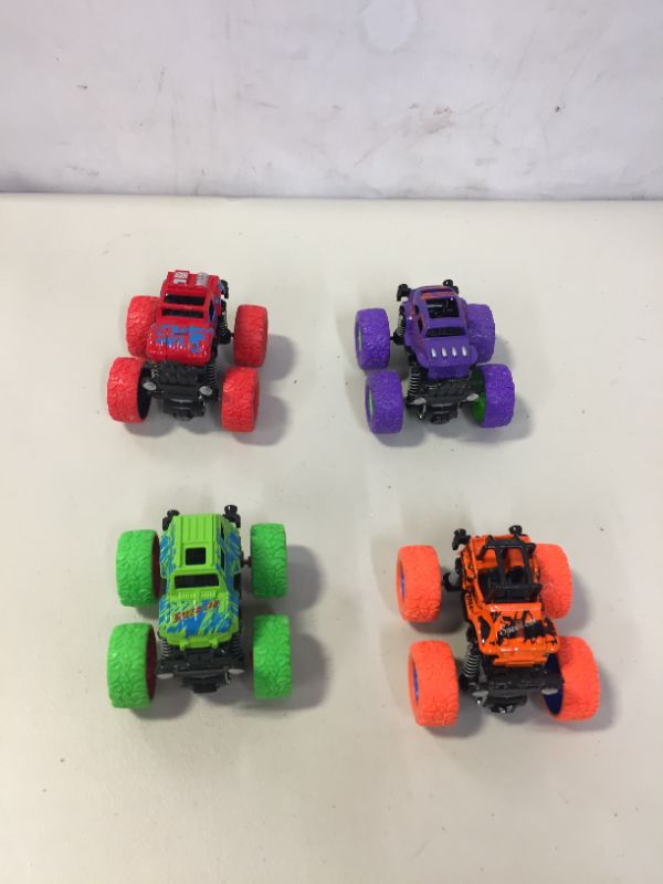 Photo 1 of 4 PC SMALL TOY MONSTER TRUCKS 