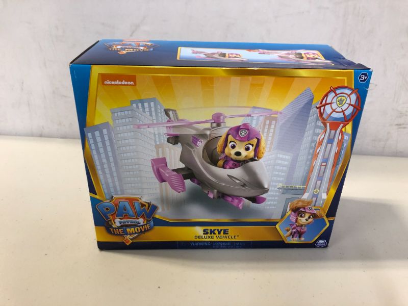 Photo 2 of Paw Patrol, Skye’s Deluxe Movie Transforming Toy Car with Collectible Action Figure, Kids Toys for Ages 3 and up
