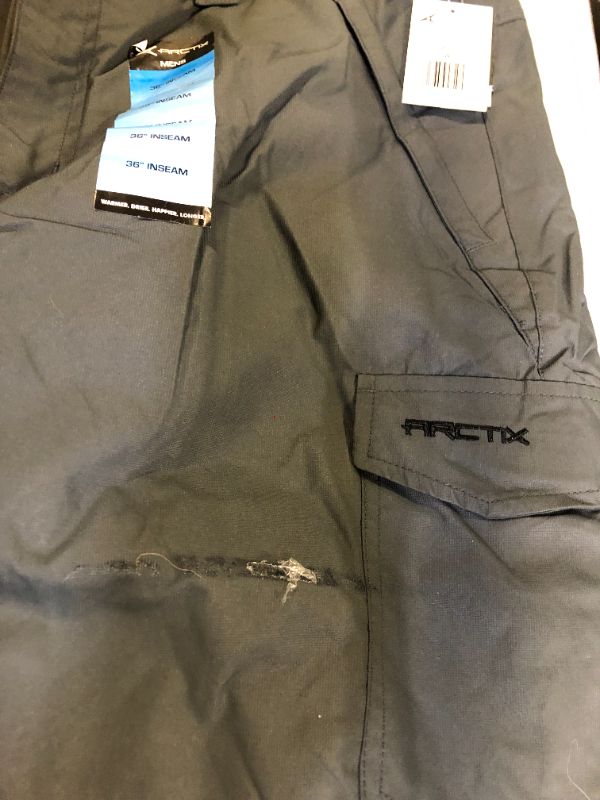 Photo 2 of Arctix Mens Snow Sports Cargo Pants 
Large/36" Inseam (has glue on pants)
